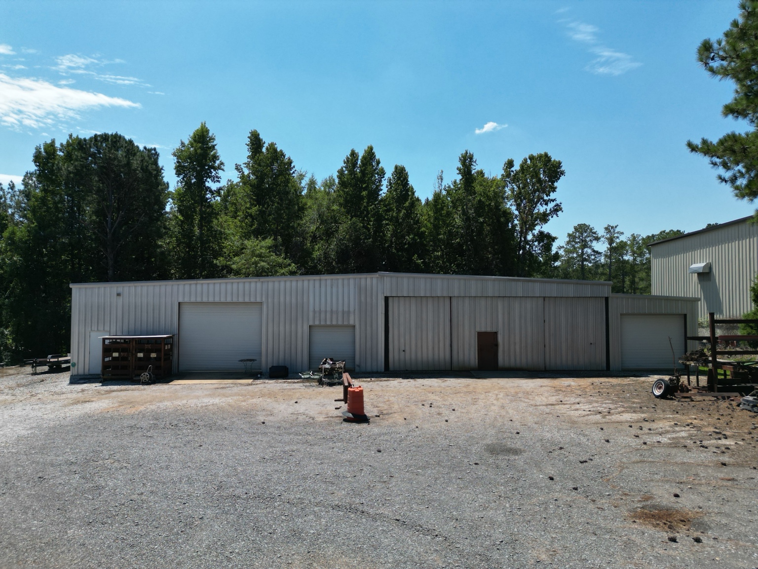 Building exterior with multiple roll-up doors.